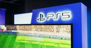 Home PS5 gaming station featuring a live soccer match onscreen, showcasing high-quality graphics.
